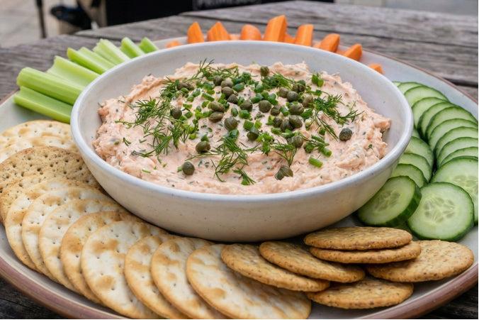 a bowl of creamy Smoked Salmon Pâté, garnished with pickled capers and fresh chopped chives