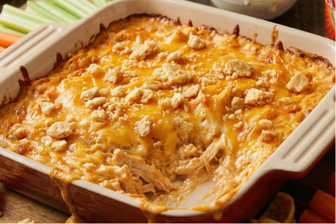 Creamy buffalo chicken dip topped with melted smoked cheddar and crushed ritz crackers