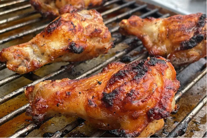 A close-up of crispy, golden-brown buffalo chicken wings