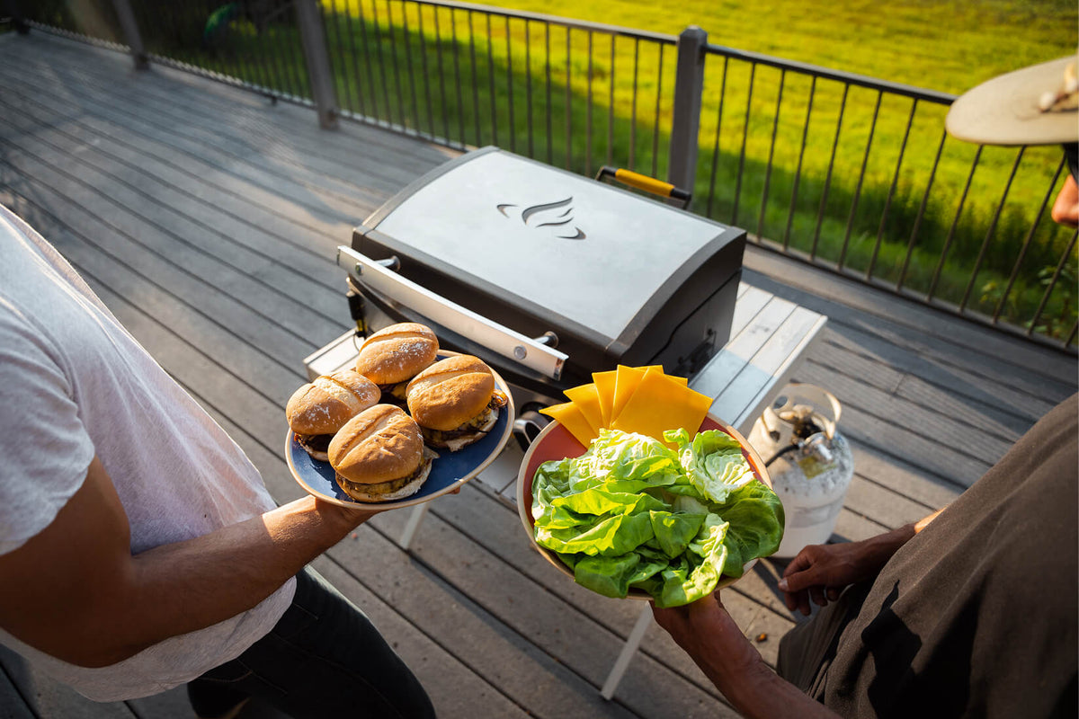 a man is grilling on an outdoor halo elite griddle