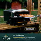 Removing a pizza from the HALO Versa oven with a stainless steel peel, featuring callouts highlighting flexible fuel options for propane or natural gas.