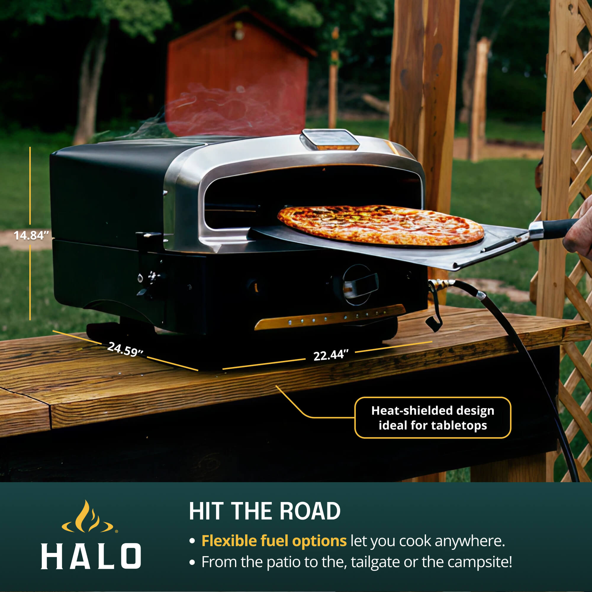 Removing a pizza from the HALO Versa oven with a stainless steel peel, featuring callouts highlighting flexible fuel options for propane or natural gas.