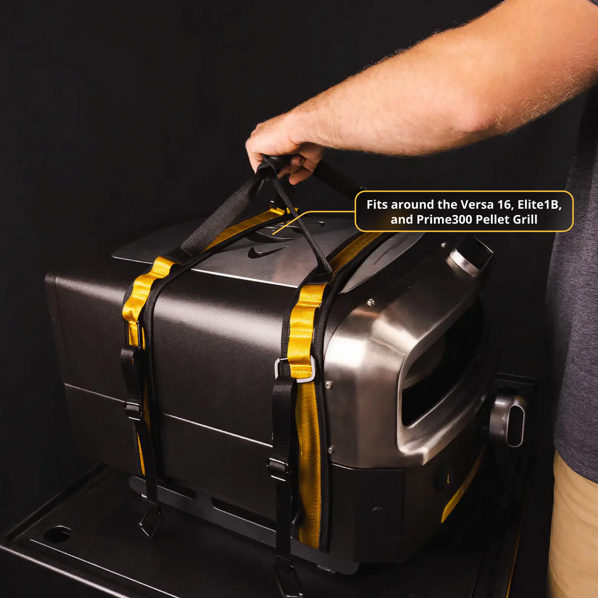 Person lifting a HALO Versa 16 pizza oven with heavy-duty carrying straps.