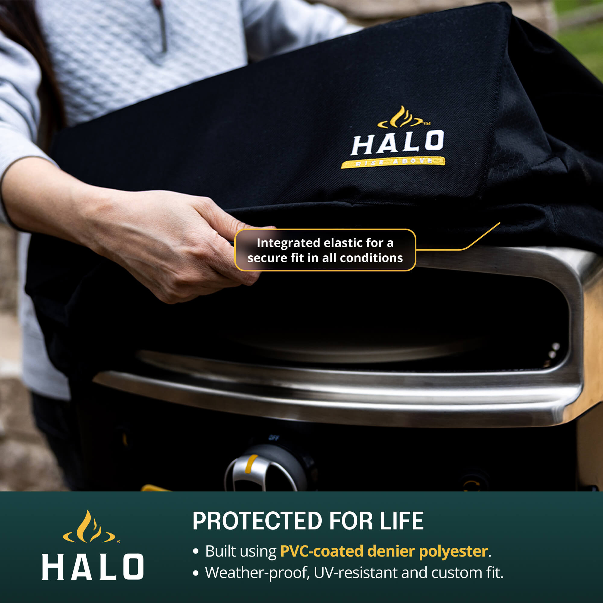 Person holding a black Halo pizza oven cover with product details.