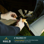 Person adjusting integrated cinching straps on a Halo Elite Griddle with close-up details.
