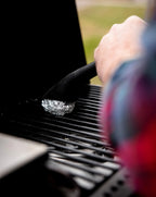 Using the HALO Foil-Fork to securely hold crumpled aluminum foil for a deep-clean of outdoor grill grates