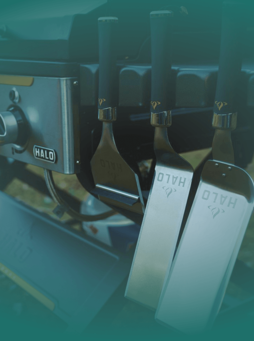 Set of Halo brand spatulas on a dark background