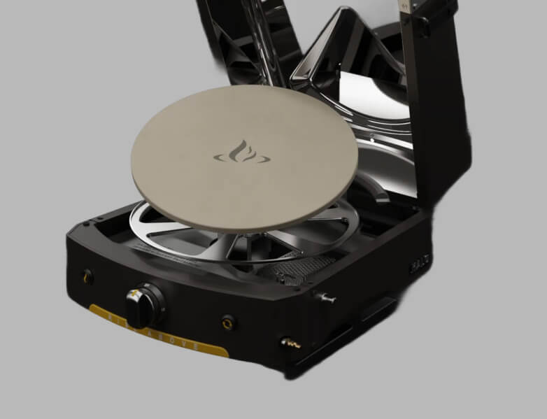 Product image of the HALO Versa 16 showing the rotating stone and wide-open hinged lid with a white background