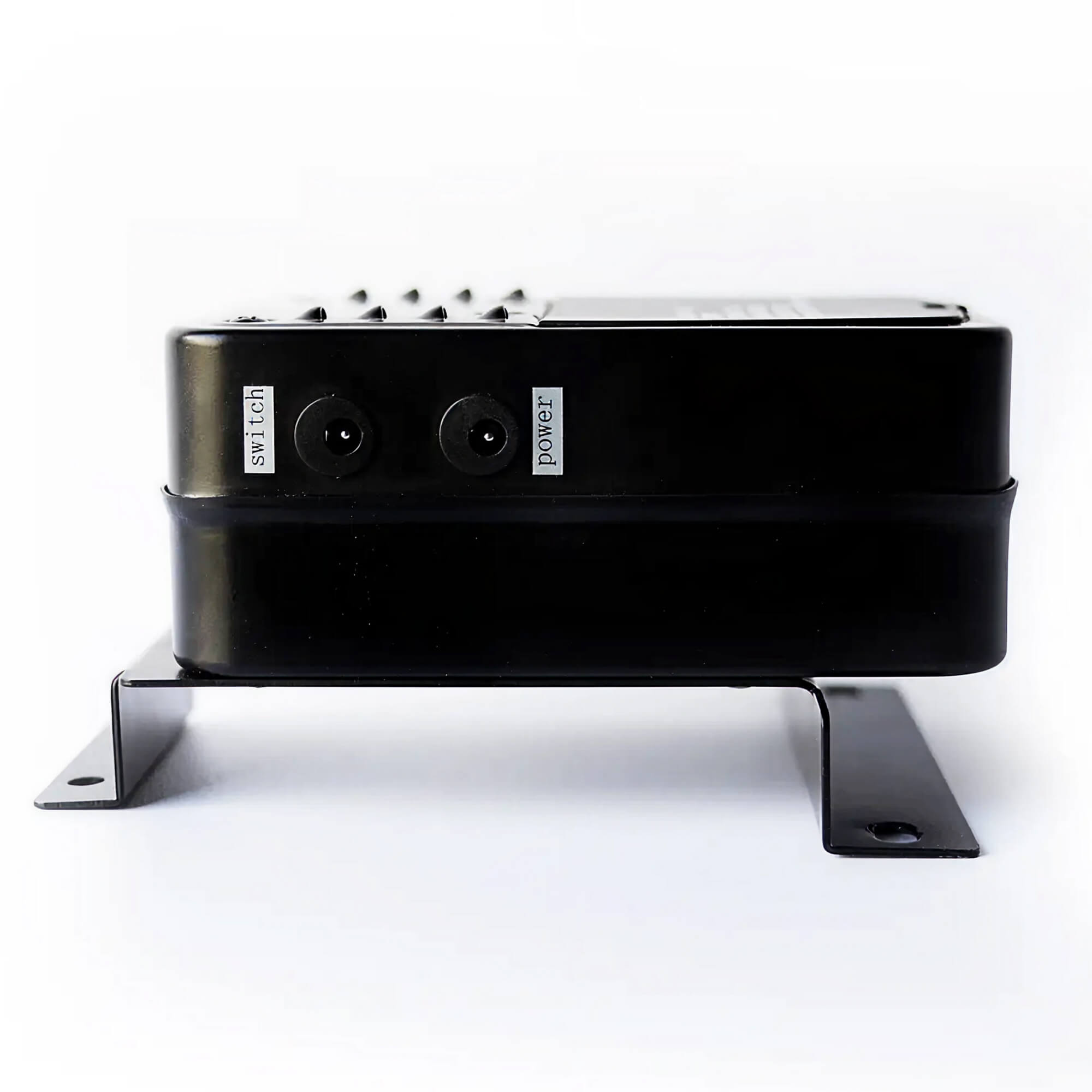 Black electronic device with 'switch' and 'power' labels on a white background