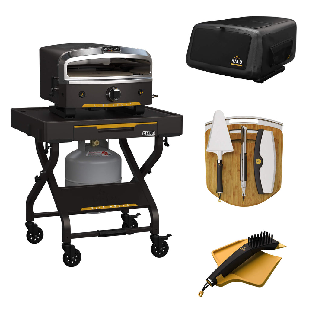 The HALO Ultimate Pizza Bundle on a black background, featuring the Versa 16 Outdoor Pizza Oven, a rolling countertop cart, a protective cover, a cook and serve kit, and a stone cleaning kit.